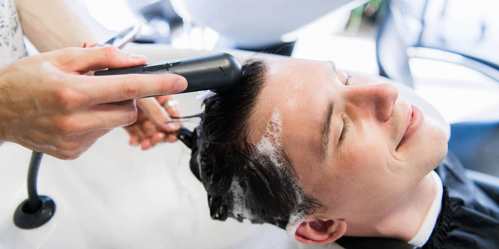 Man washing his hair