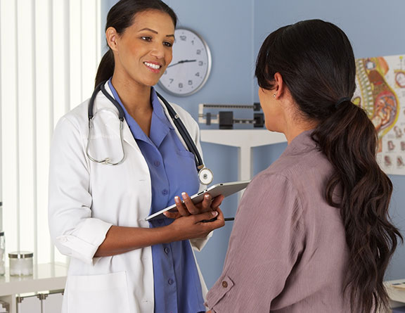 Gynecologist speaking to a female patient